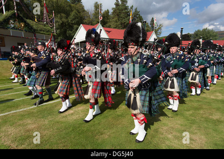 Village of Braemar, Scotland. The massed pipe bands marching at the Royal Braemar Gathering games. Stock Photo