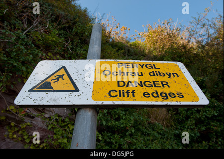 View of a cliff warning sign in the town of Laugharne,  Wales UK Stock Photo