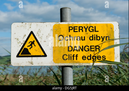 View of a cliff warning sign in the town of Laugharne, the Birthplace of the Poet Dylan Thomas, Wales UK Stock Photo