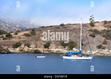 A sailboat and dingy anchored in a bay at Catalina Island. Stock Photo