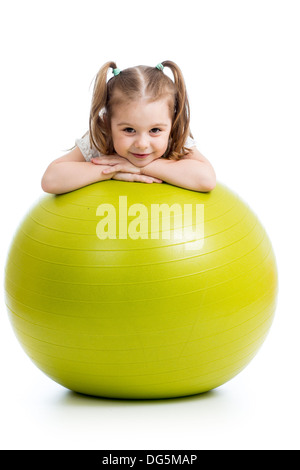 Kid girl having fun with gymnastic ball isolated Stock Photo