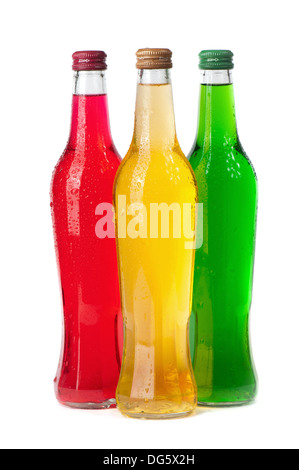 Assortment of cold bottles of pop or coolers on white background Stock Photo
