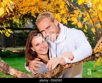 portrait of a happy young couple in the park, smiling. Stock Photo