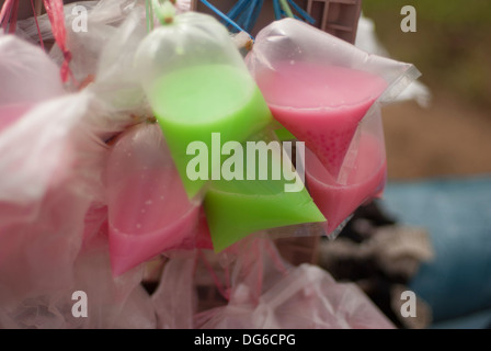 Brightly coloured drinks on sale to agricultural workers in Kengtung province, Burma (Myanmar) Stock Photo