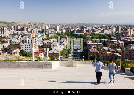 People at the Cascade monument and overview of Yerevan downtown, Armenia Stock Photo