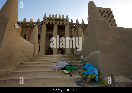 MALI, DJENNE, JANUARY 11: Unidentified People sleeping on the stairs of the Big Mosque in Djenné at dawn, Mali.2011 Stock Photo