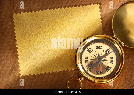 Blank yellow card and compass Stock Photo