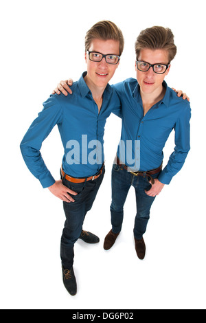 Identically adult male twins in studio Stock Photo