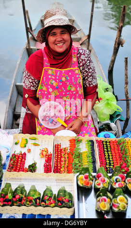 Boat vendor at the Hatyai's Klong Hae Floating Market in Southern Thailand Stock Photo