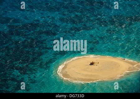 Aerial view of Upolu Cay Great Barrier Reef rising out of the Coral Sea high enough for location of helicopter landing site Stock Photo