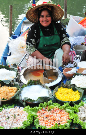 Boat vendor at the Boat vendor at the Hatyai's Klong Hae Floating Market in Southern Thailand Stock Photo