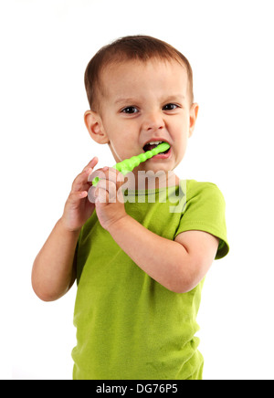 Cute little boy brushing teeth, isolated on white background Stock Photo