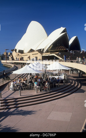 Australia, Sydney, the opera house and street cafe along East Quay. Stock Photo