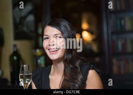 Young beautiful woman in nightclub Stock Photo