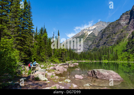 Hikers on the shore of Avalanche Lake, Glacier National Park, Montana, USA Stock Photo