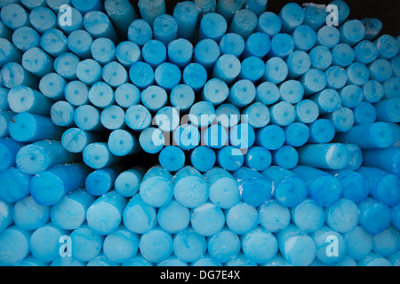 Close up of a group of blue circle candles in Lourdes in France. The Lourdes Sanctuary offers you the possibility of leaving and Stock Photo