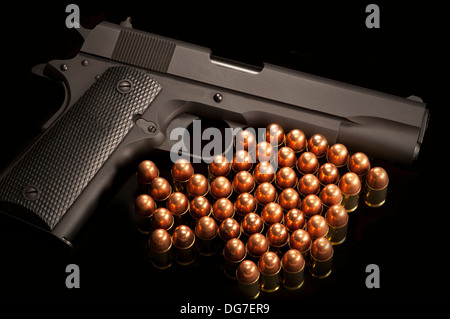 Gun and cartridges Stock Photo