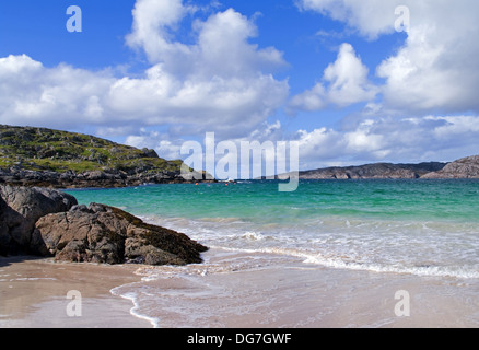 Wave breaking onto white sand beach, Achmelvich Bay near Lochinver, Assynt, Northwest Sutherland, Northern Highlands Scotland UK Stock Photo