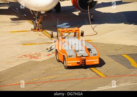 Aircraft tow truck at the airport apron Stock Photo - Alamy