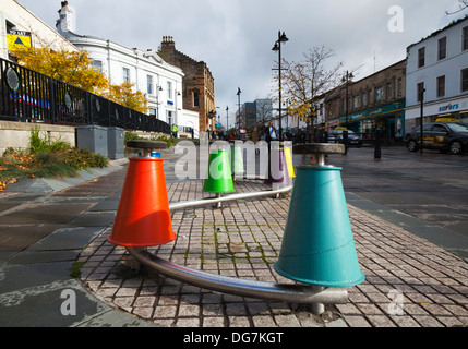 Large Cotton Bobbins as Street Architecture  The streets, shops and businesses of Airdrie a town in North Lanarkshire, Scotland. Stock Photo