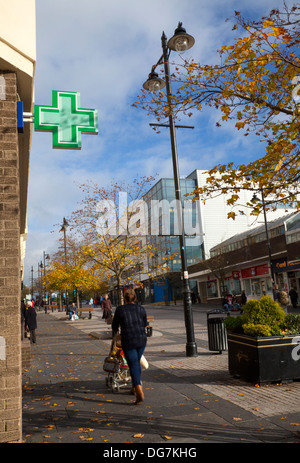 Pharmacy Green Cross  The streets, shops and businesses of Airdrie a town in North Lanarkshire, Scotland. Stock Photo