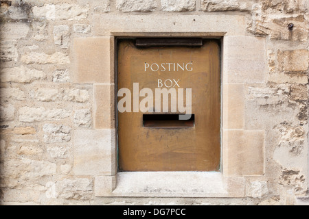 Metal posting box inset in a stone wall Stock Photo - Alamy