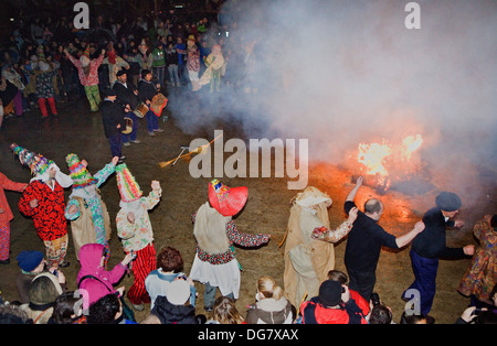 Txatxos dancing the Zortziko dance, and Miel Otxin burning.In FrontÃ³nÂ´. Lantz carnival. Navarra. Spain Stock Photo