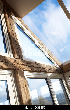 Detail of an Orangery type conservatory interior of a house with oak frame. Stock Photo