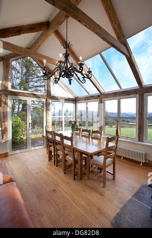 An Orangery type conservatory interior of a house with oak frame, in Stroud, England,UK. Stock Photo