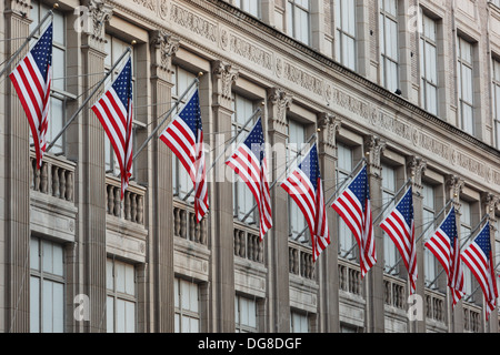 American flags on Saks Fifth Avenue store in New York, USA. Stock Photo