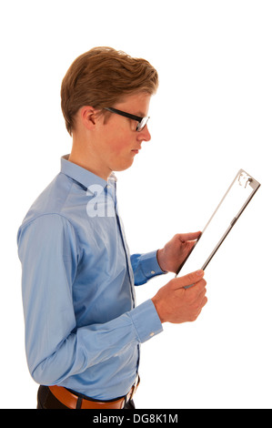 Man in blue shirt holding and reading from a black clipboard Stock Photo