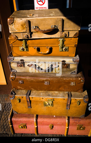 Pile of old suitcases on railway platform in Bridgnorth station UK Stock Photo