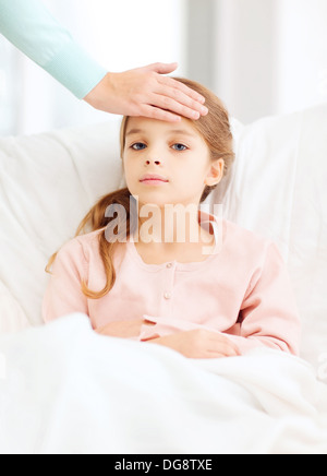 ill girl child and caring mother Stock Photo