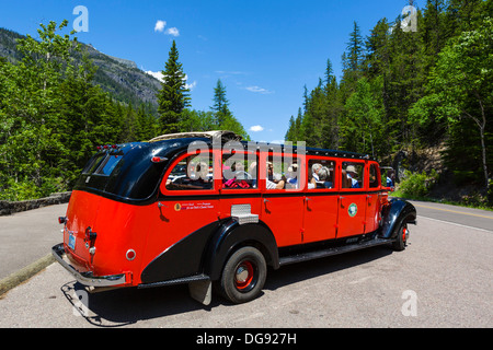 Red Bus Tour in the parking area of McDonald Falls, Glacier National Park, Montana, USA Stock Photo