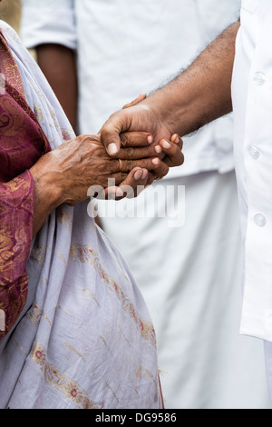 Indian doctor shaking an elderly womans hand at the Sathya Sai Baba mobile outreach hospital clinic. Andhra Pradesh, India Stock Photo