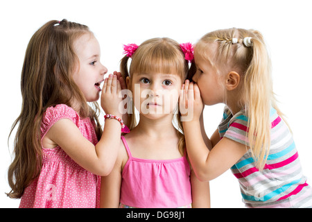 kids girlfriends sharing a secret isolated Stock Photo