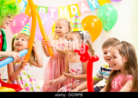 kids group and clown on birthday party Stock Photo