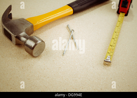 Hammer, nails and tape measure Stock Photo