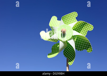 toy pinwheel against clear blue sky Stock Photo