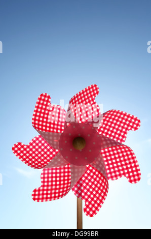 toy pinwheel against clear blue sky Stock Photo