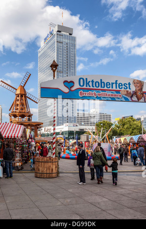 People enjoy stalls, funfair and beer gardens at the Oktoberfest fair, Alexander Platz, Berlin Stock Photo
