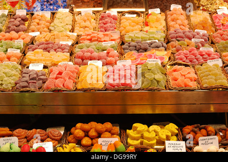 Confectionery shop in indoor market La Boqueria on Las Ramblas. Barcelona. Catalonia. Spain. Showing sweets and pastries Stock Photo