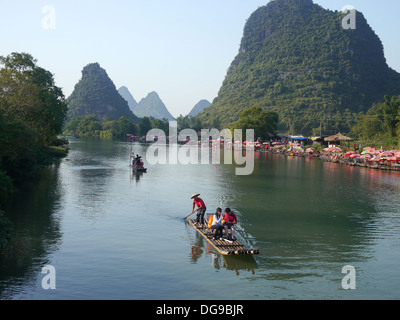 China, Yangshuo County, Bamboo rafts on the Yulong River Karst formations Stock Photo