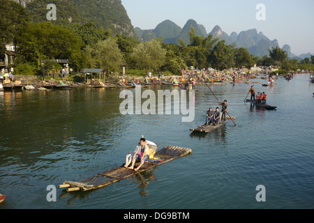 China, Yangshuo County, Bamboo rafts on the Yulong River Karst formations Stock Photo