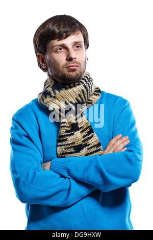 Young man wearing a scarf and a sweater folded his arms across his chest Stock Photo