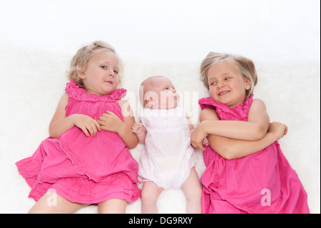happy little girls with baby sister Stock Photo