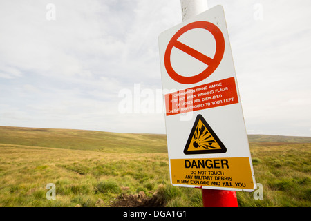 A warning sign about the danger of the firing range on Dartmoor, Devon, UK. Stock Photo