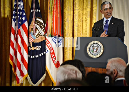 US President Barack Obama speaks during the Medal of Honor ceremony for Army Capt. William D. Swenson in the East Room of the White House October 15, 2013 in Washington, DC. The Medal of Honor is the nation's highest military honor. Stock Photo