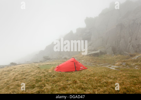 Wild Camping on Glyder Fach in Low Cloud. Snowdonia National Park, Conwy, Wales, UK. Stock Photo