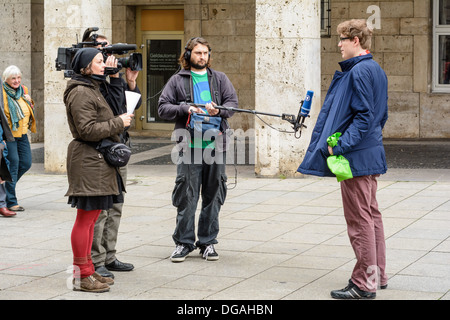 German television camera crew (ARD, WDR) interviewing a young Caucasian man on the street – Königstraße Stuttgart Germany Stock Photo